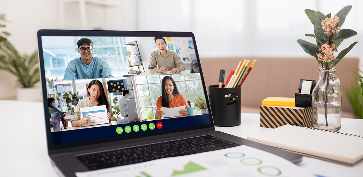 Video conference on laptop with 4 people